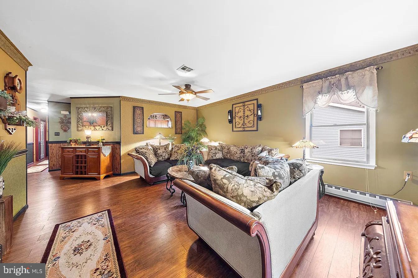 22 Fir Road Manahawkin, NJ 08050 - Photo 5 of 35 a living room with furniture and wooden floor
