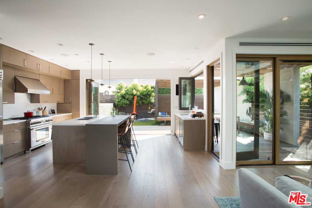 3108 Yale Avenue Venice, CA 90292 - Photo 14 of 46 a kitchen with a large window and stainless steel appliances