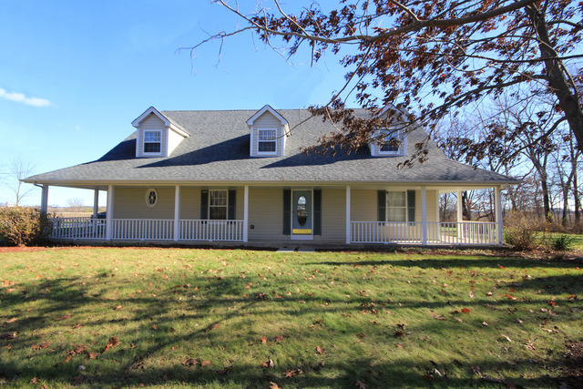 9-n301 Percy Road Maple Park, IL 60151 - Photo 1 of 25 a front view of a house with a yard