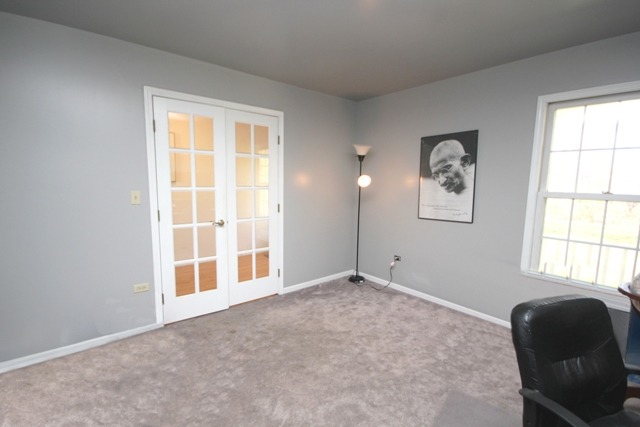 9-n301 Percy Road Maple Park, IL 60151 - Photo 16 of 25 a view of an empty room and window