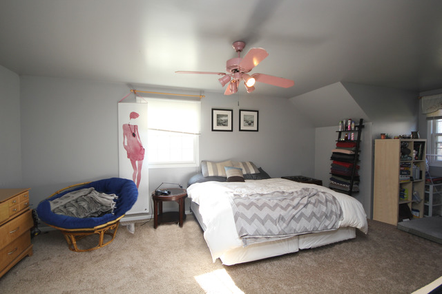 9-n301 Percy Road Maple Park, IL 60151 - Photo 17 of 25 a bedroom with a bed and a chandelier