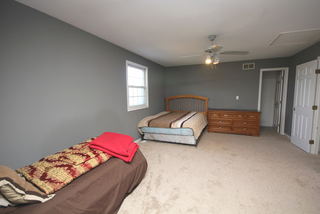 9-n301 Percy Road Maple Park, IL 60151 - Photo 18 of 25 a bedroom with bed and window