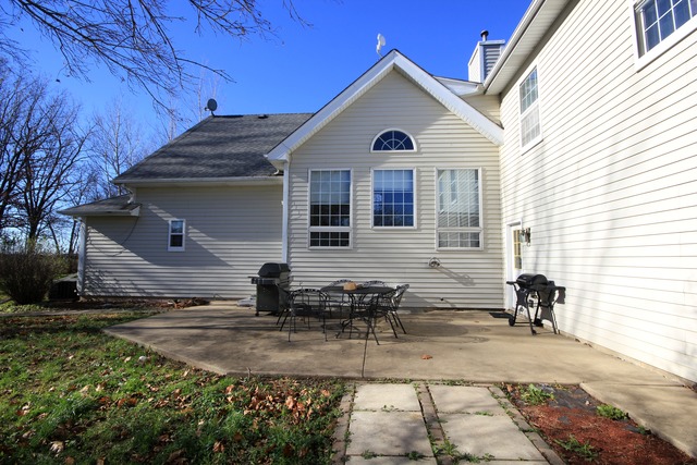 9-n301 Percy Road Maple Park, IL 60151 - Photo 20 of 25 a view of a back yard of the house