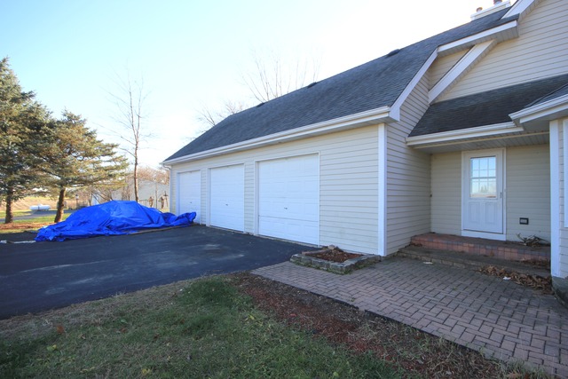 9-n301 Percy Road Maple Park, IL 60151 - Photo 22 of 25 a view of a house with backyard