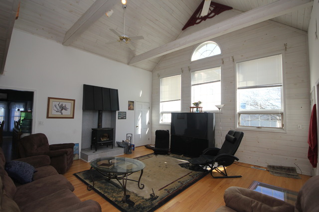 9-n301 Percy Road Maple Park, IL 60151 - Photo 4 of 25 a living room with furniture a flat screen tv and a fireplace