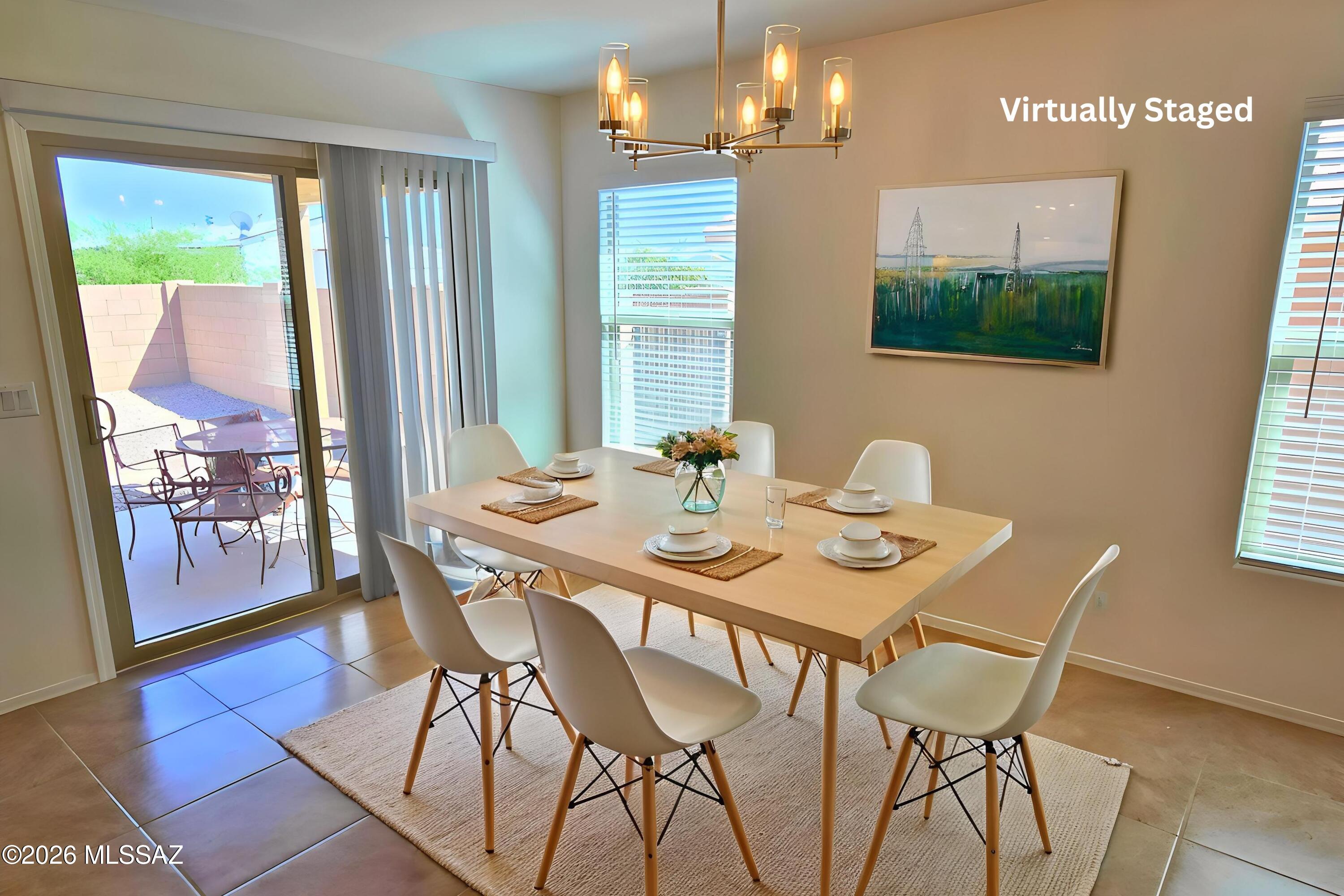 6343 South Rigby Way Tucson, AZ 85746 - Photo 9 of 29 a view of a dining room with furniture window and wooden floor