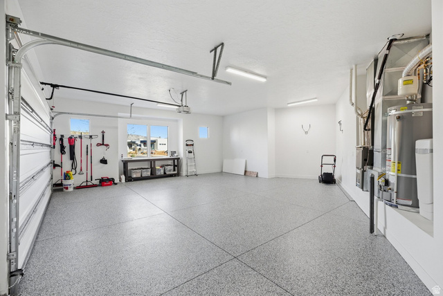2197 Reserve Circle St. George, UT 84770 - Photo 47 of 57 Garage featuring gas water heater and heating unit