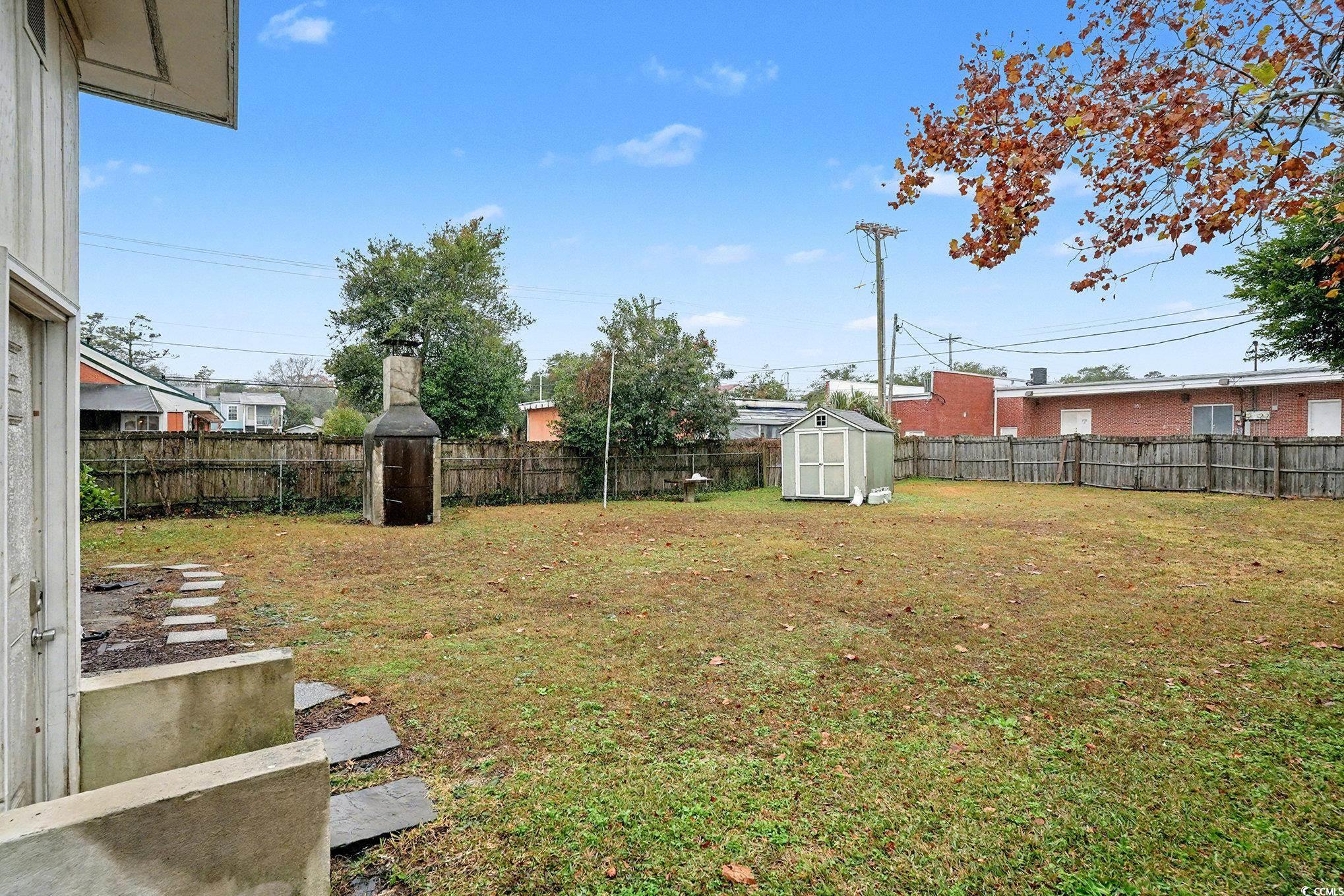 603 Maple Street Myrtle Beach, SC 29577 - Photo 38 of 40 Fenced backyard with a shed