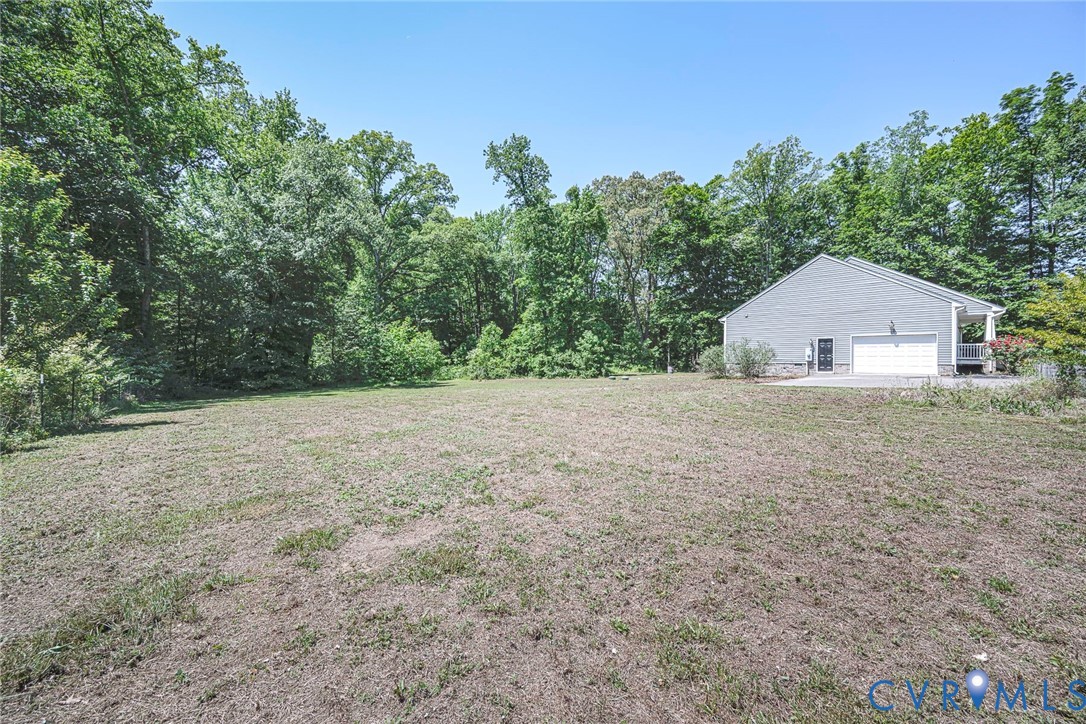 1297 Manfield Road Aylett, VA 23009 - Photo 37 of 41 a house with a yard