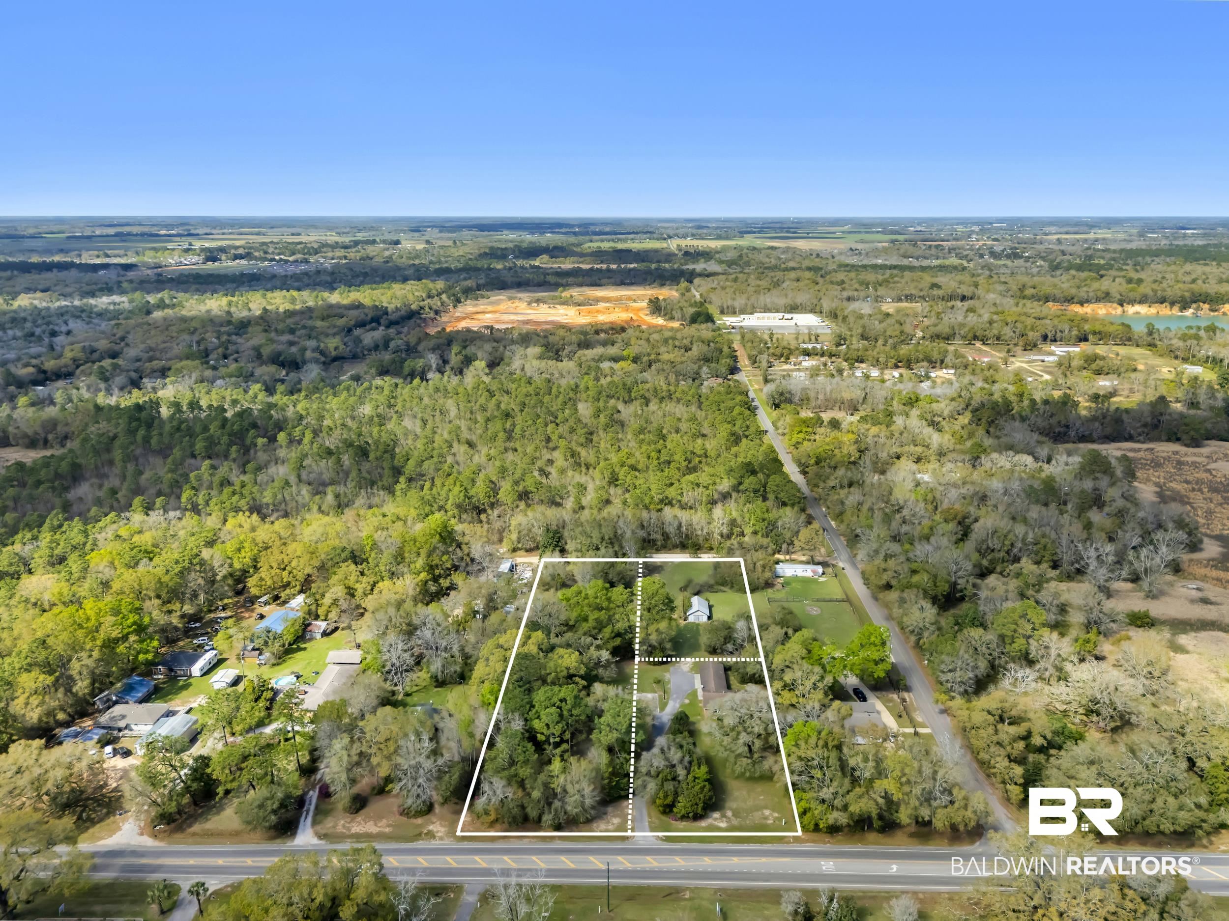 17463 Highway 98 Foley, AL 36535 - Photo 37 of 57 Aerial view of property and surrounding area with a forest and property boundaries highlighted