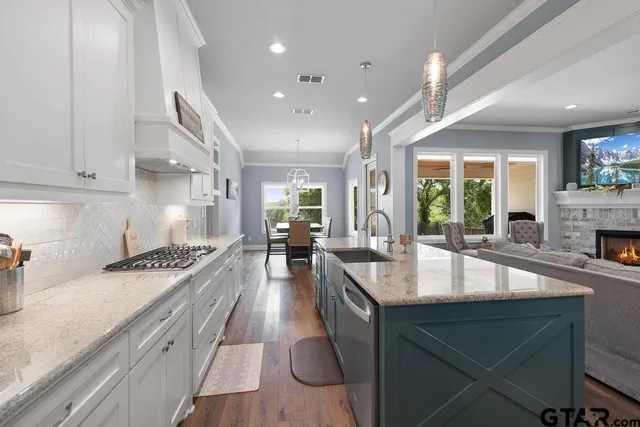 a large kitchen with granite countertop a lot of counter space
