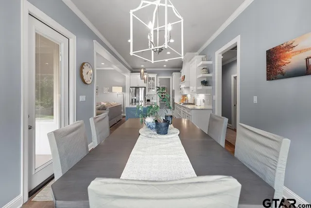 a view of an entryway with wooden floor and a large window
