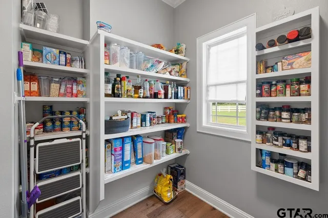 a shelf with books and knick knacks on it