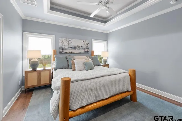 a bedroom with a bed and a table