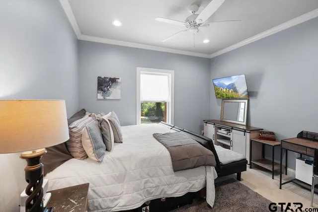 a bedroom with a bed and a desk