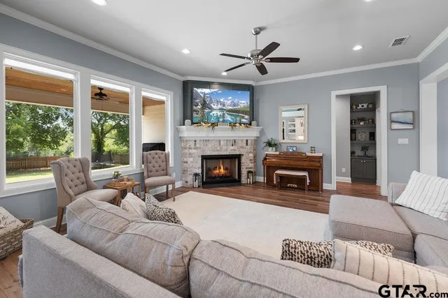 a living room with furniture and a fireplace