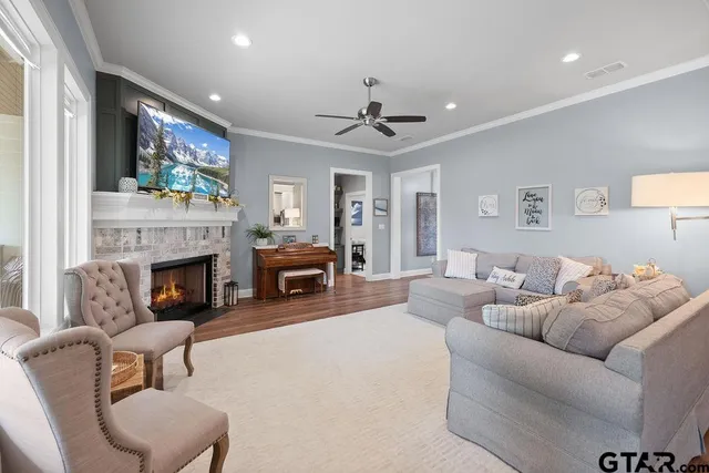 a living room with furniture and a fireplace