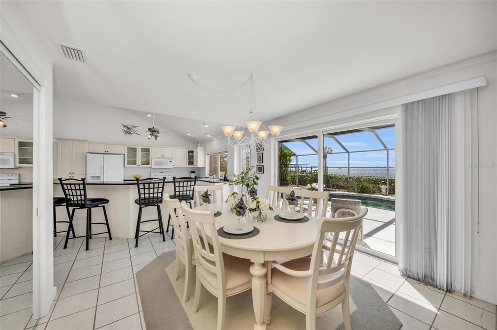 12440 Placida Road Placida, FL 33946 - Photo 25 of 96 a view of a dining room with furniture and chandelier