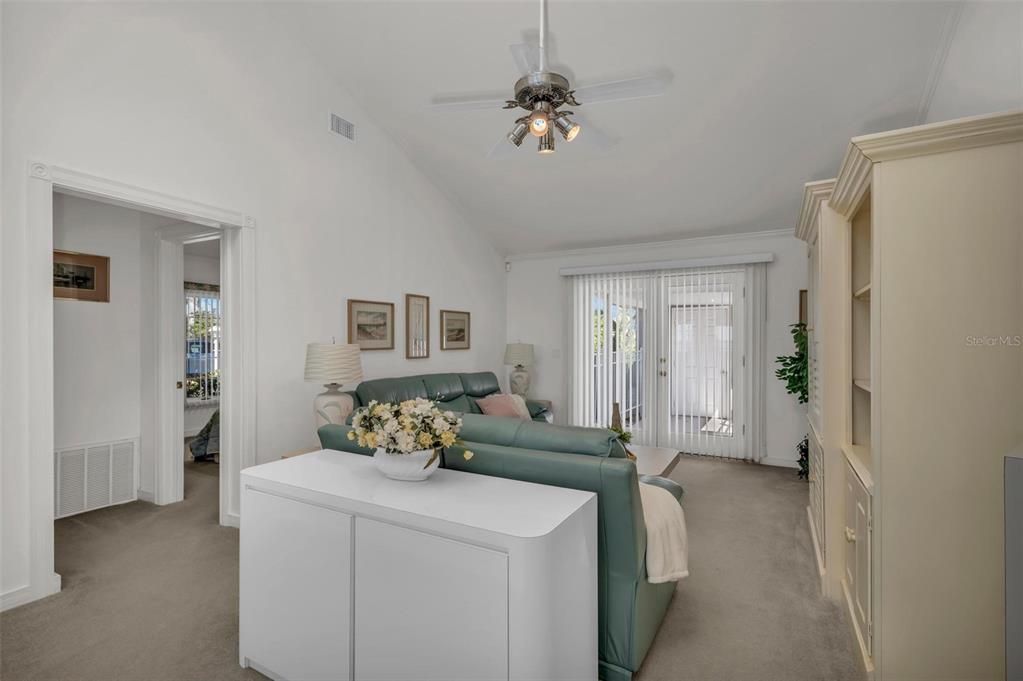 12440 Placida Road Placida, FL 33946 - Photo 34 of 96 a living room with furniture and a chandelier