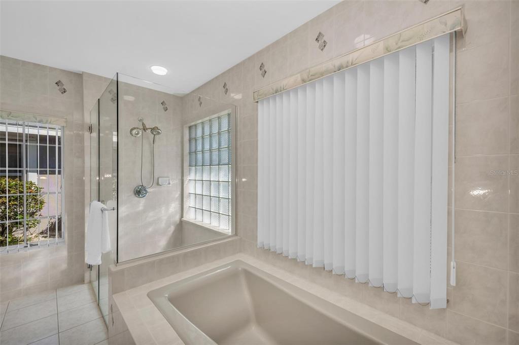 12440 Placida Road Placida, FL 33946 - Photo 42 of 96 a bathroom with a shower and a tub
