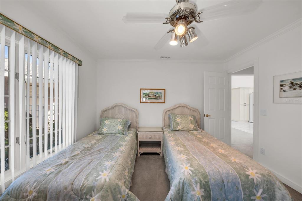 12440 Placida Road Placida, FL 33946 - Photo 46 of 96 a bedroom with a bed and wooden floor