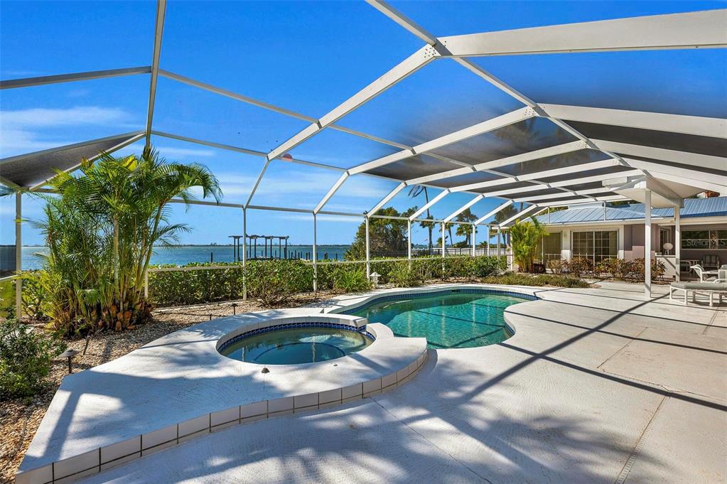 12440 Placida Road Placida, FL 33946 - Photo 59 of 96 a view of a swimming pool with a patio