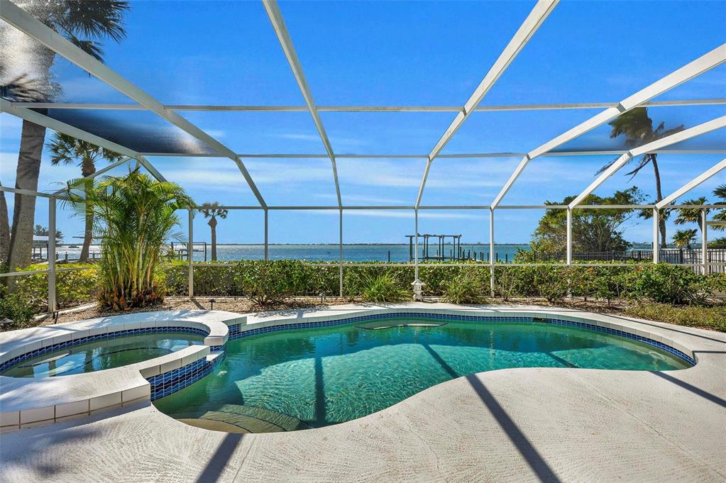12440 Placida Road Placida, FL 33946 - Photo 61 of 96 a view of a swimming pool with a patio
