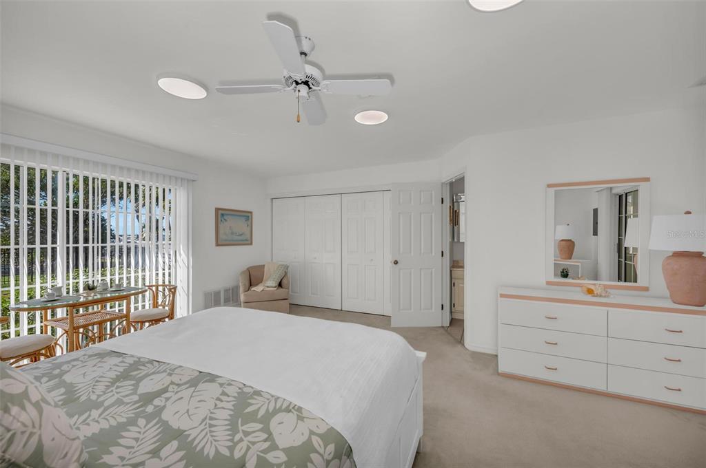 12440 Placida Road Placida, FL 33946 - Photo 67 of 96 a bedroom with a large bed and a window