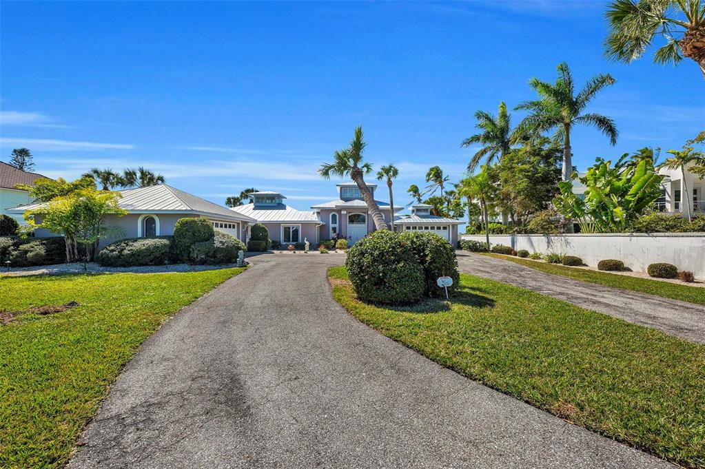 12440 Placida Road Placida, FL 33946 - Photo 82 of 96 a view of a garden with lawn chairs