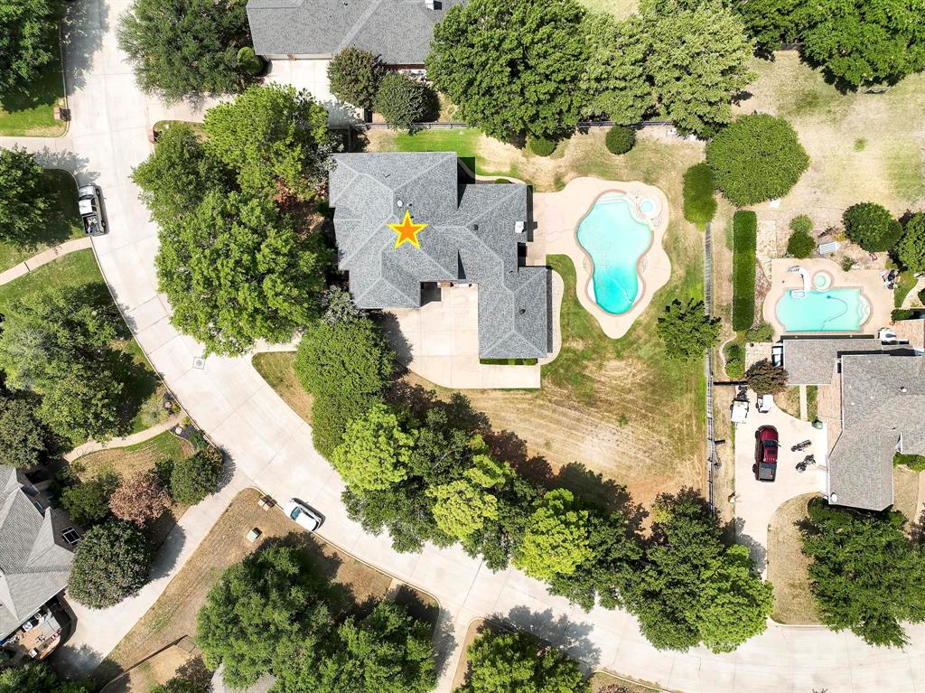 an aerial view of residential house with outdoor space and swimming pool