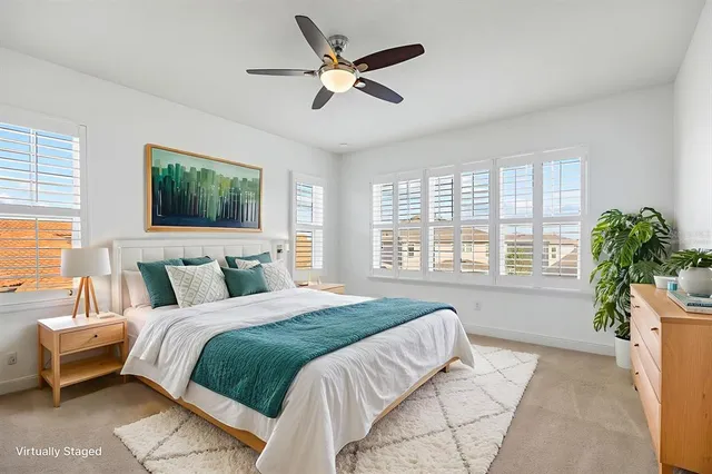 a view of a house with a yard and tree s