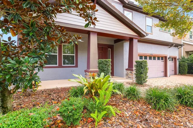 a kitchen with stainless steel appliances granite countertop a sink a stove and refrigerator