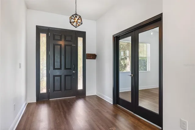 a kitchen with stainless steel appliances granite countertop a sink stove and microwave