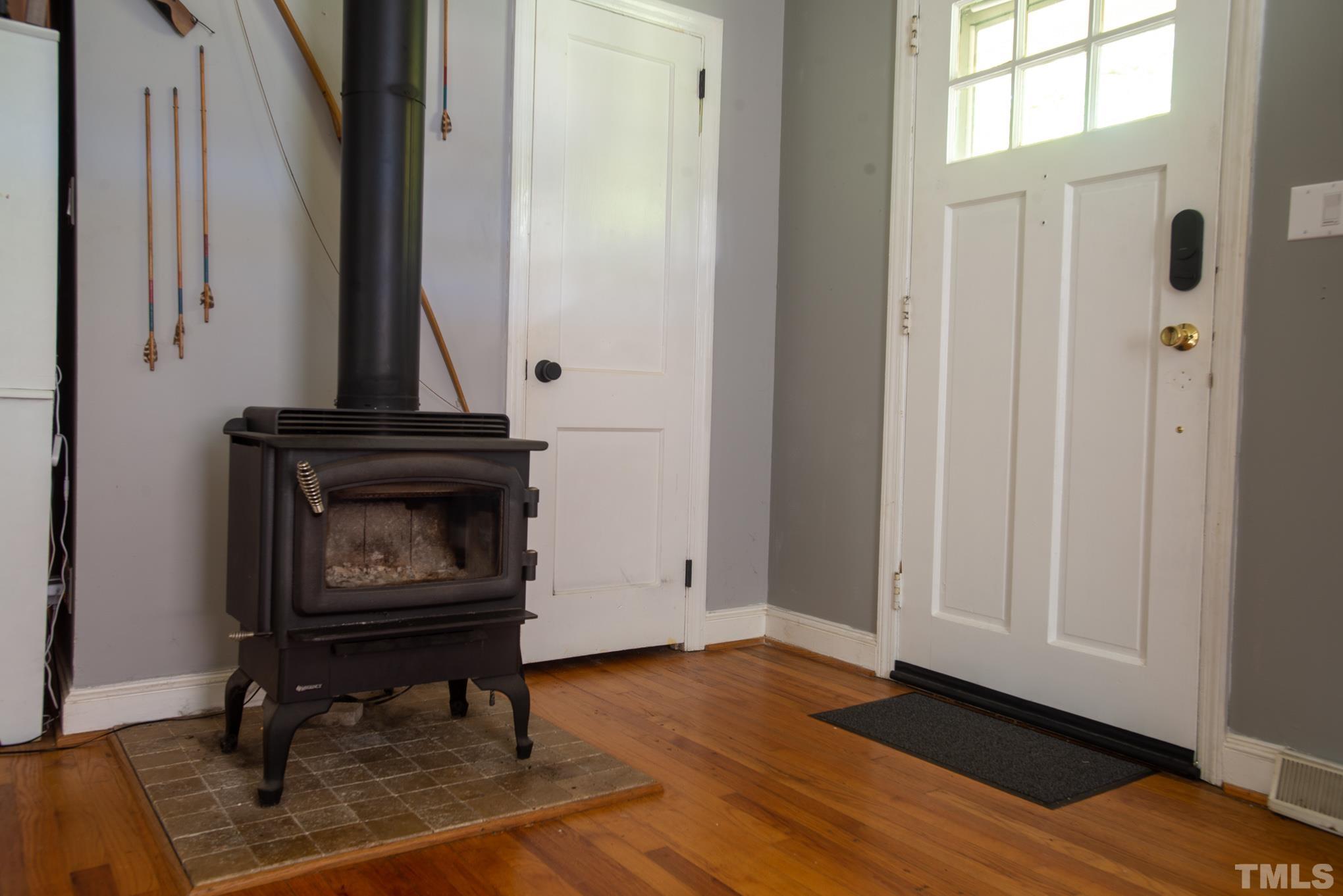 2336 Stevens Road Raleigh, NC 27610 - Photo 8 of 28 a living room with furniture and a fireplace