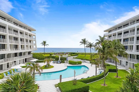 a view of a swimming pool with a patio