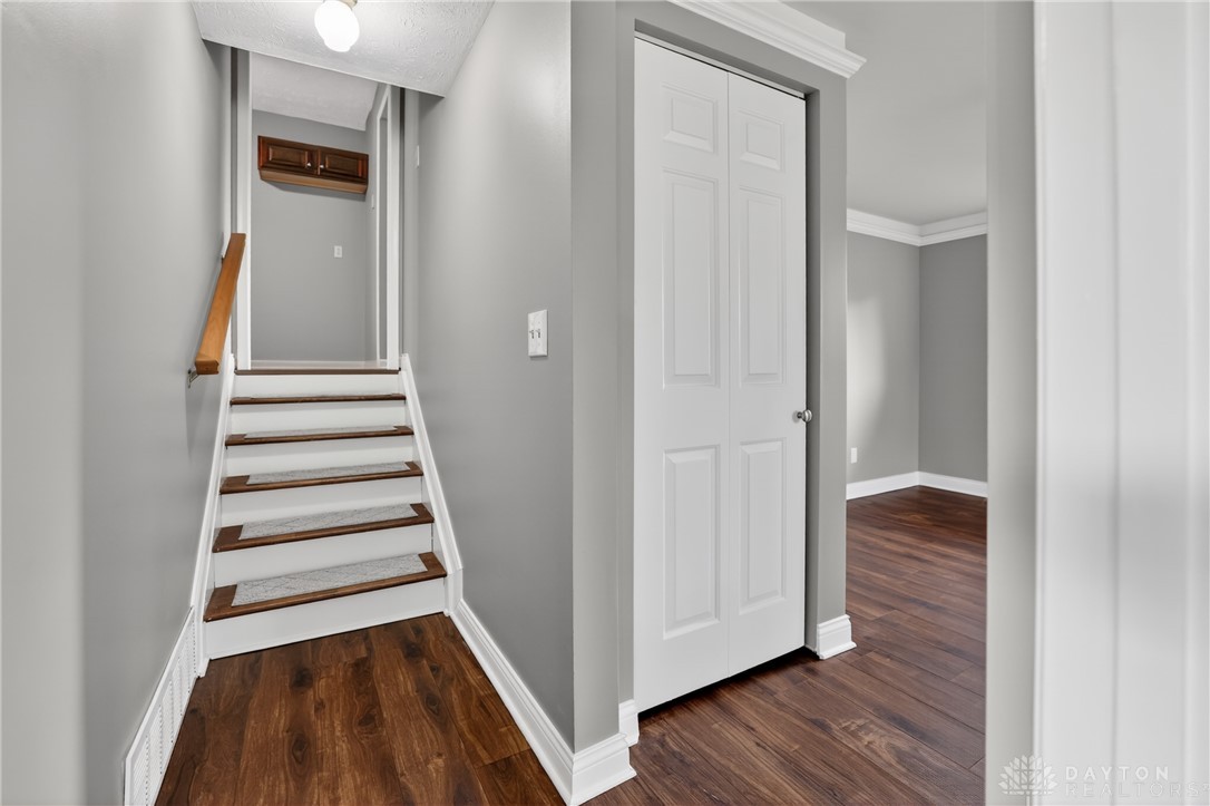 5741 Gray Road Fairfield, OH 45014 - Photo 11 of 32 This interior features a well-crafted staircase, crown molding, and hardwood flooring.