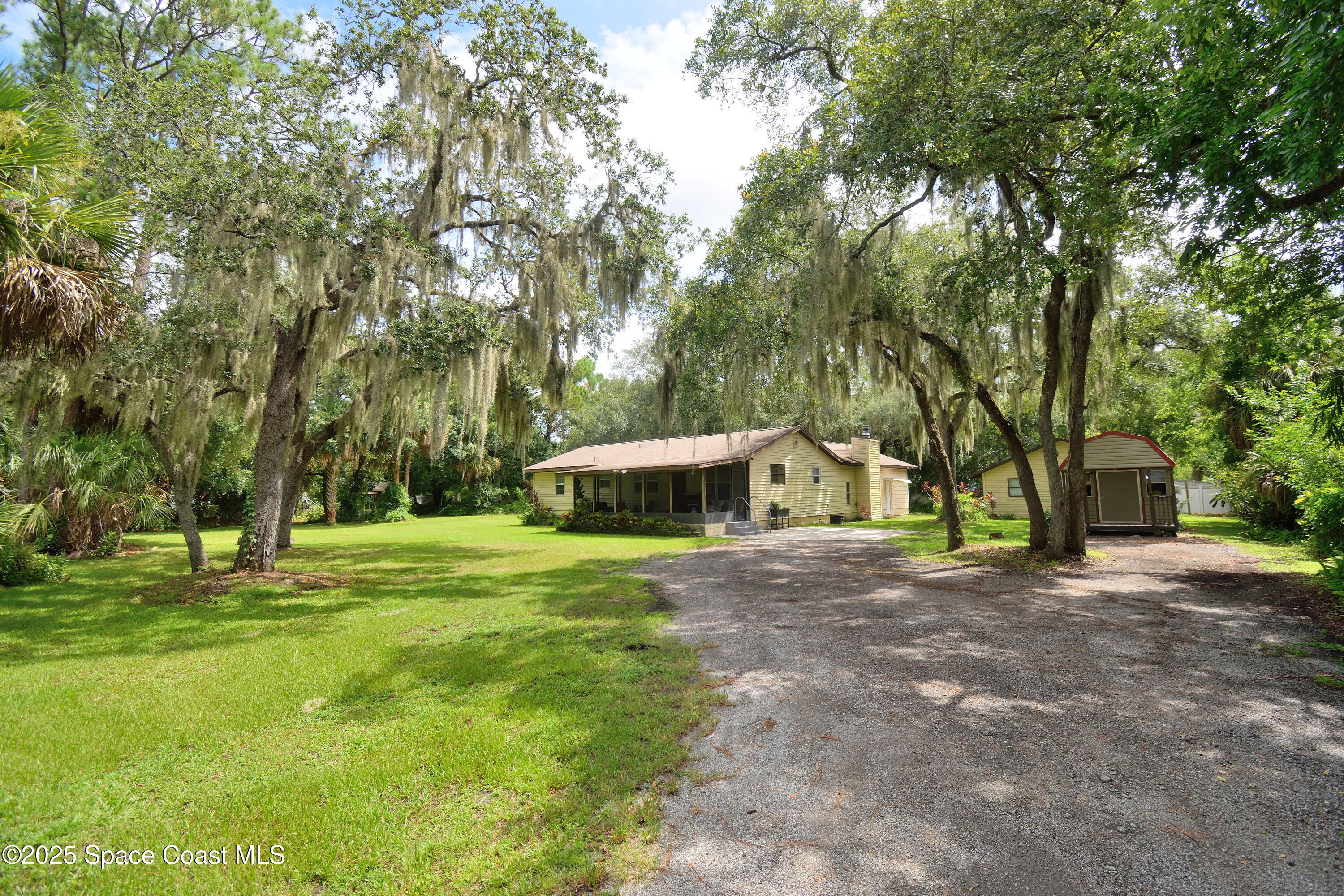 745 Cox Road Cocoa, FL 32926 - Photo 2 of 21 Love the shade trees and Spanish moss