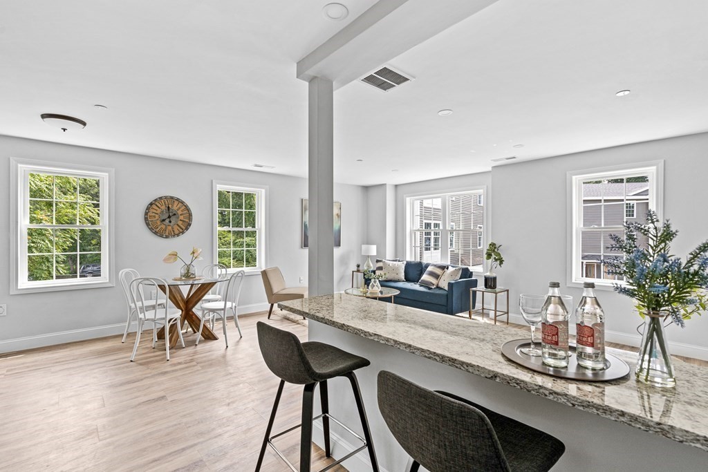 543 Andover Street, Unit 6 Lawrence, MA 01843 - Photo 13 of 27 a living room with furniture and a large window