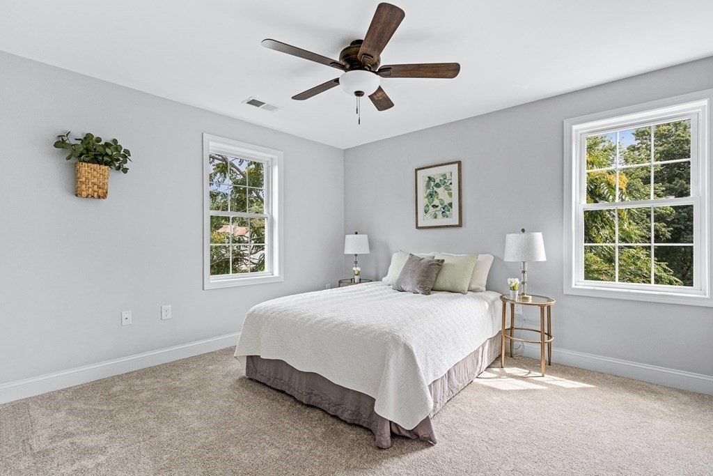 543 Andover Street, Unit 6 Lawrence, MA 01843 - Photo 15 of 27 a bedroom with a bed window and a window