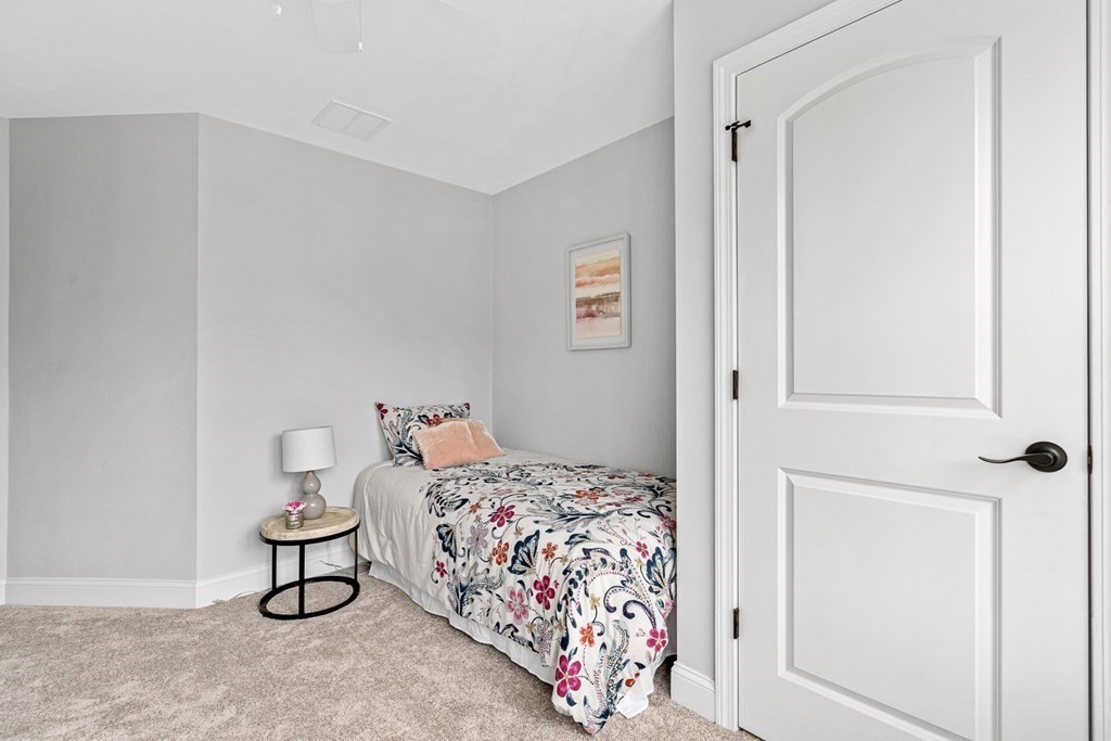 543 Andover Street, Unit 6 Lawrence, MA 01843 - Photo 18 of 27 a bedroom with a bed and closet