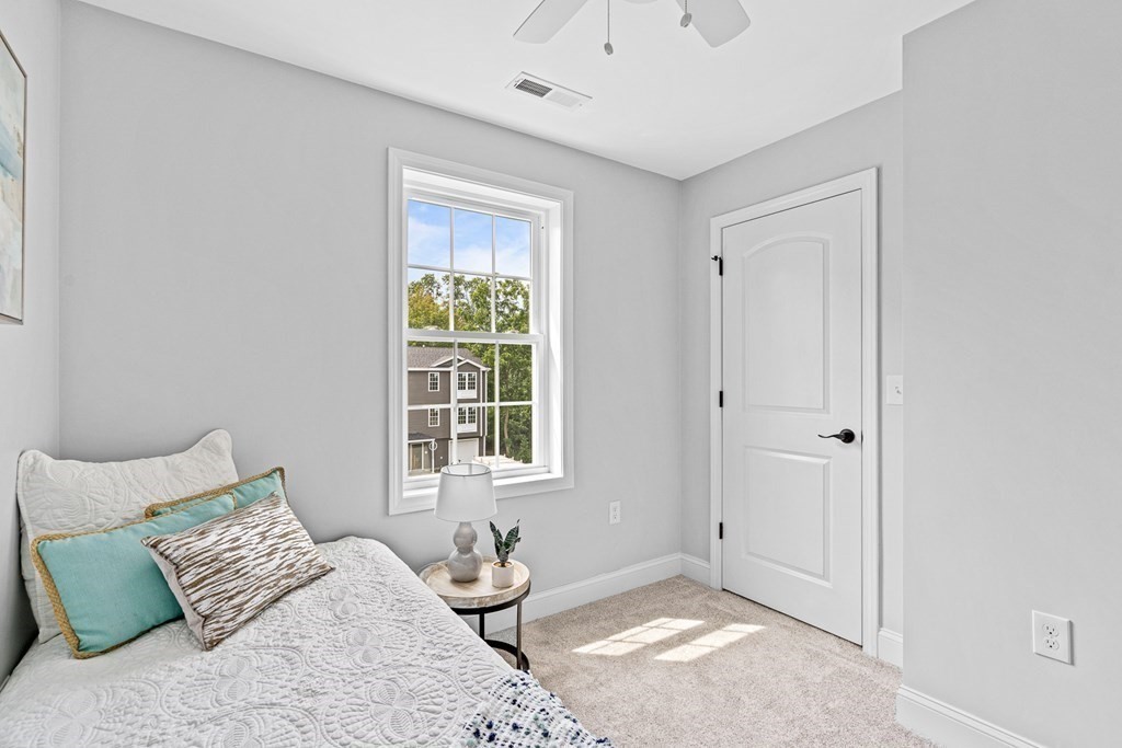 543 Andover Street, Unit 6 Lawrence, MA 01843 - Photo 20 of 27 a bedroom with a bed and a window