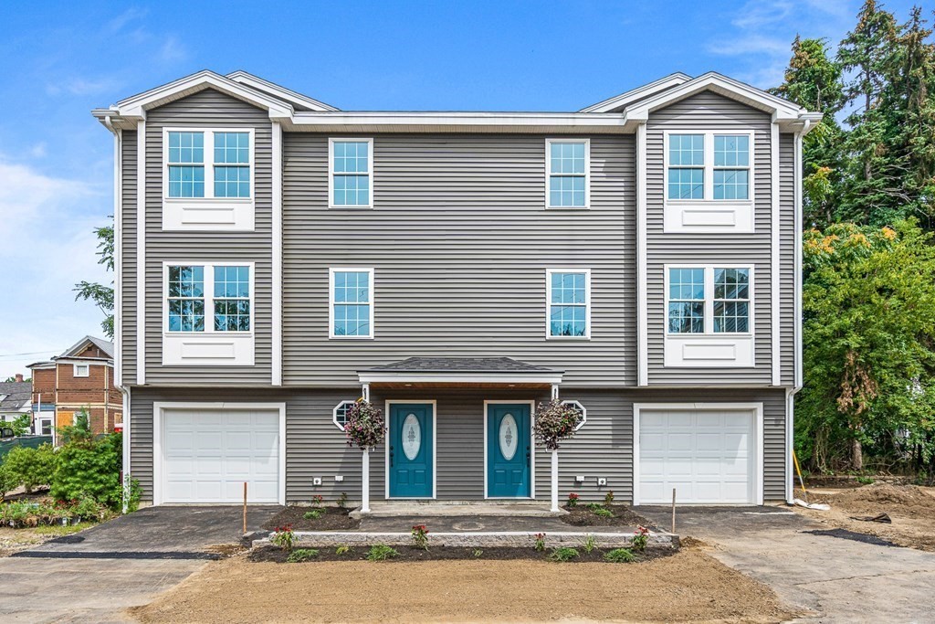 543 Andover Street, Unit 6 Lawrence, MA 01843 - Photo 26 of 27 a front view of a house with garden