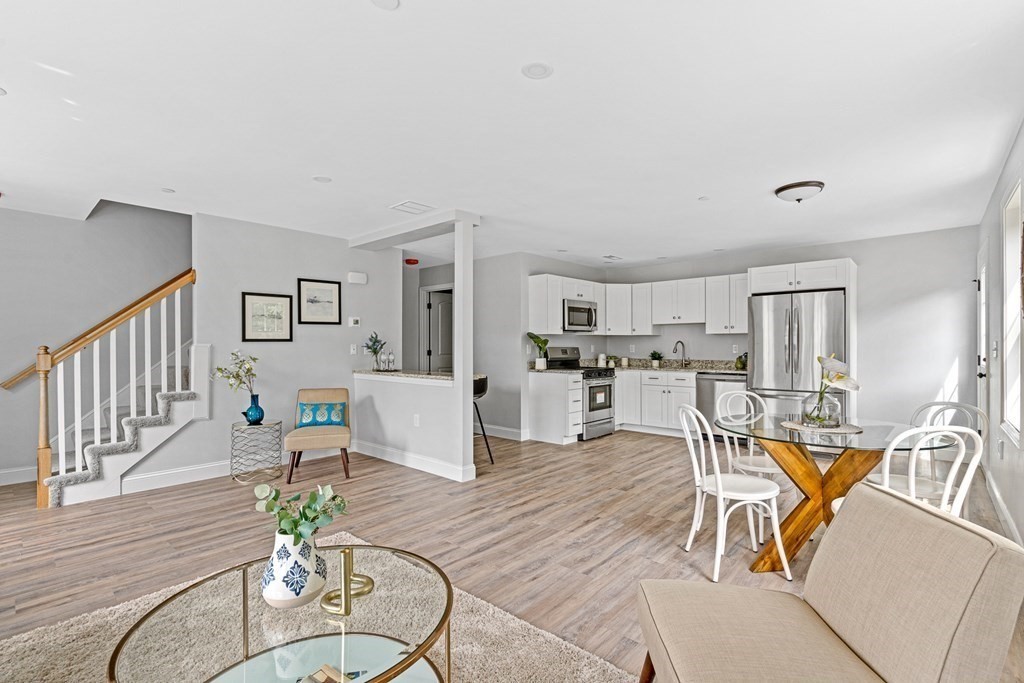 543 Andover Street, Unit 6 Lawrence, MA 01843 - Photo 3 of 27 a view of a livingroom with furniture and wooden floor