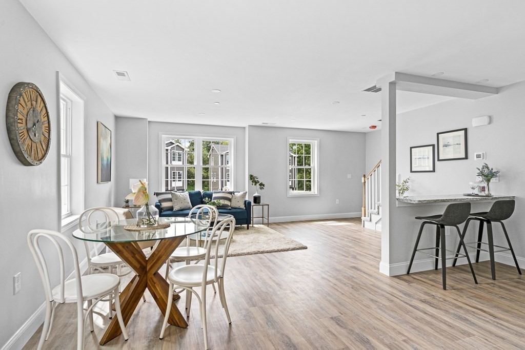 543 Andover Street, Unit 6 Lawrence, MA 01843 - Photo 5 of 27 a view of a dining room with furniture and wooden floor