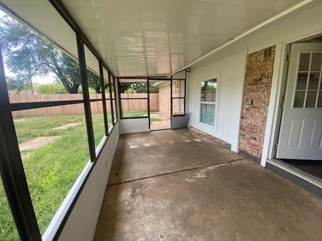 a view of a hallway with a porch