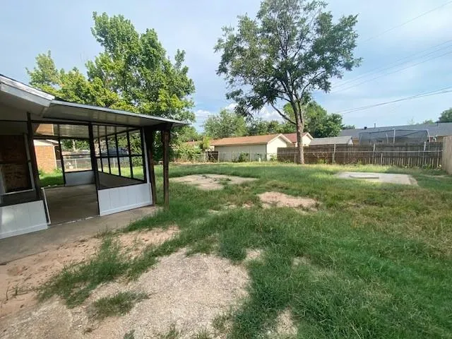 a view of a backyard with a garden and plants