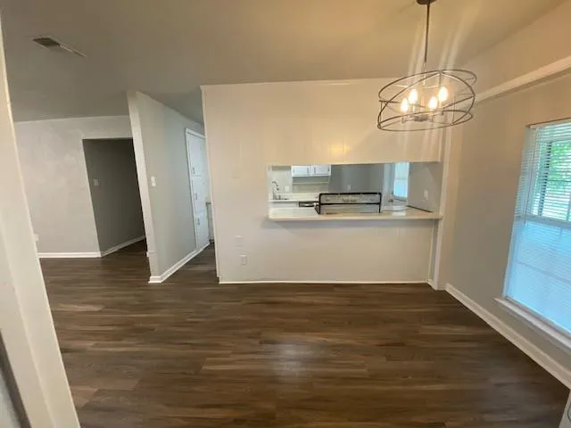 a view of cabinets and wooden floor