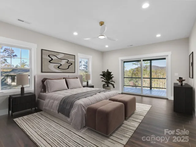 a spacious bedroom with a large bed and a couch