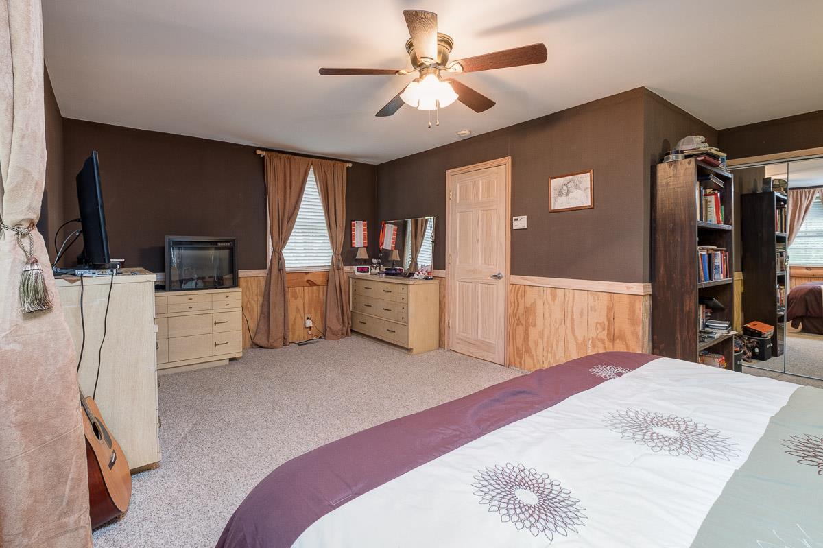 7187 Bahne Road Fairview, TN 37062 - Photo 17 of 30 a bed room with a bed and a television