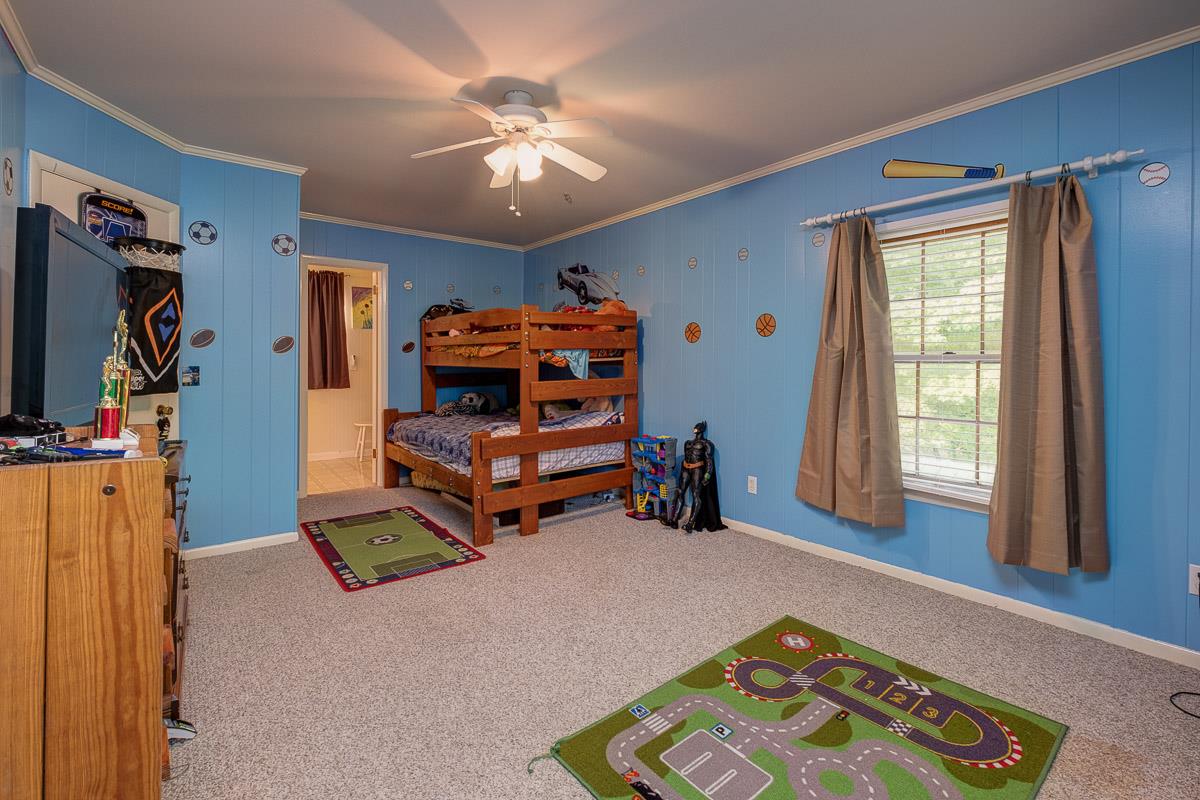 7187 Bahne Road Fairview, TN 37062 - Photo 21 of 30 a bedroom with furniture and a window